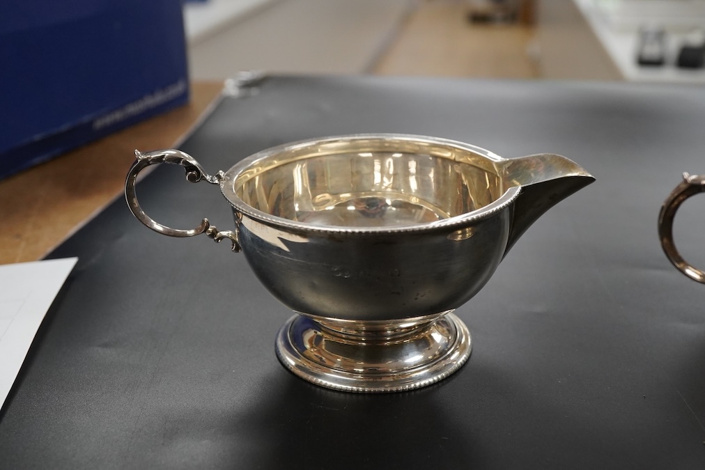 A George V silver three piece tea set teapot handle to spout 24cm., weight approx. 19.28ozt